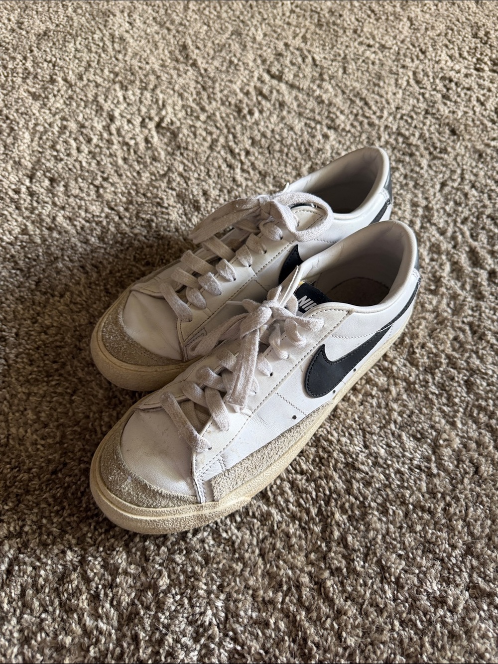 Nike women’s White Low-Top Sneakers with Black Swoosh
